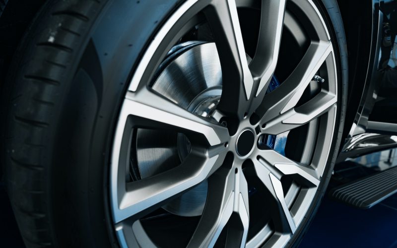 Aluminium rim of luxury car wheel close up